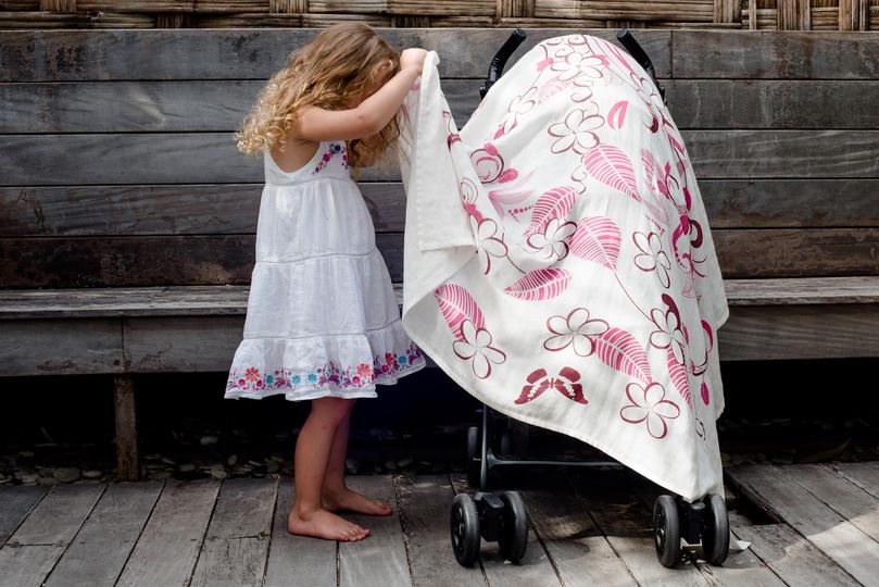Little Poppin pink swaddle on stroller